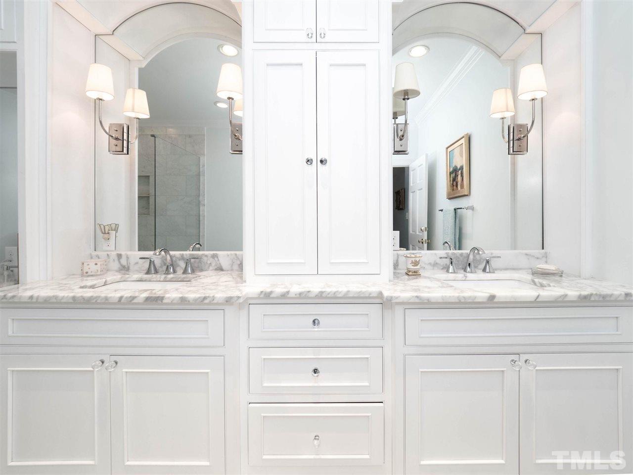 3521 Barron Berkeley Way Raleigh, NC 27612 - Photo 19 of 30 a bathroom with a sink and a mirror