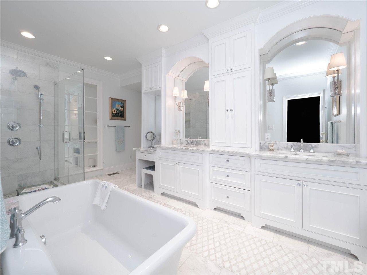 3521 Barron Berkeley Way Raleigh, NC 27612 - Photo 20 of 30 a spacious bathroom with a tub sink and mirror