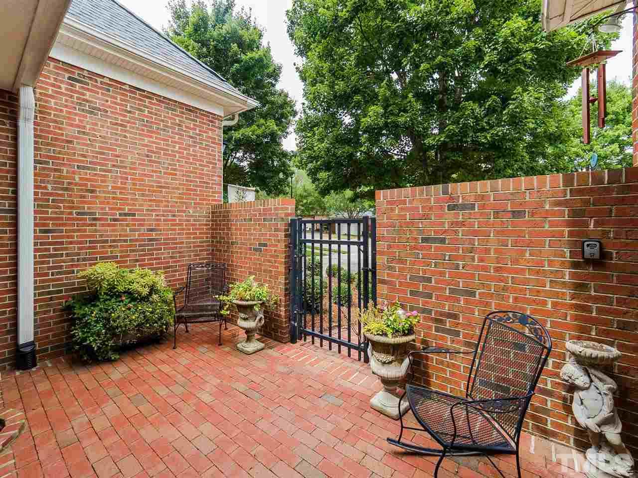 3521 Barron Berkeley Way Raleigh, NC 27612 - Photo 29 of 30 a view of a chair and table in the patio