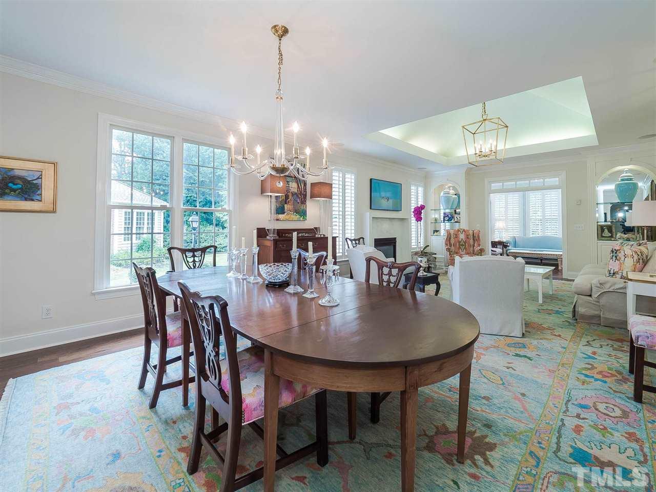 3521 Barron Berkeley Way Raleigh, NC 27612 - Photo 5 of 30 a view of a dining room with furniture window and wooden floor