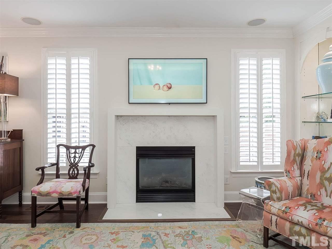 3521 Barron Berkeley Way Raleigh, NC 27612 - Photo 10 of 30 a living room with furniture a window and a fireplace