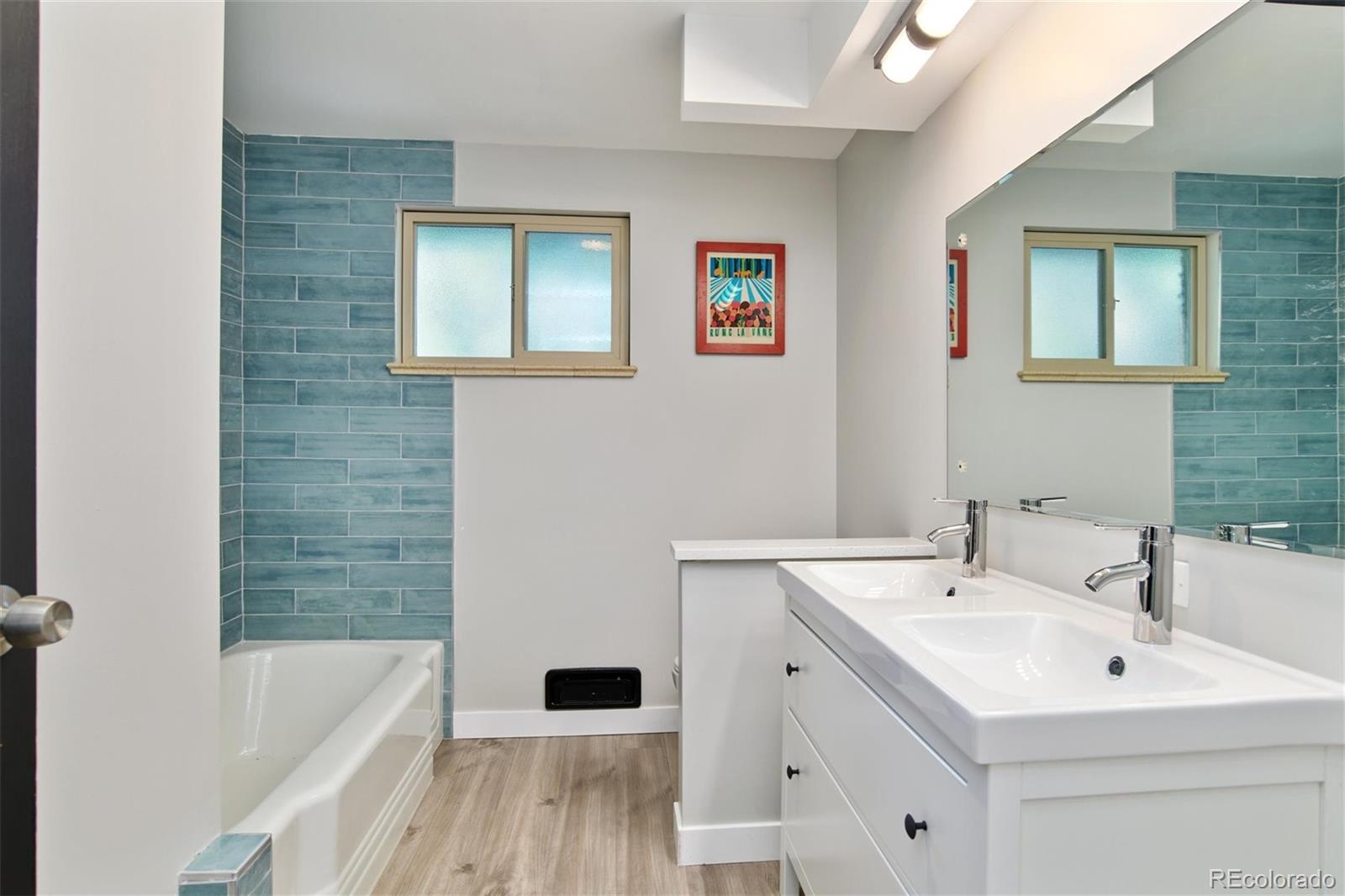 3225 Vance Street Wheat Ridge, CO 80033 - Photo 13 of 29 a bathroom with a sink and a bathtub