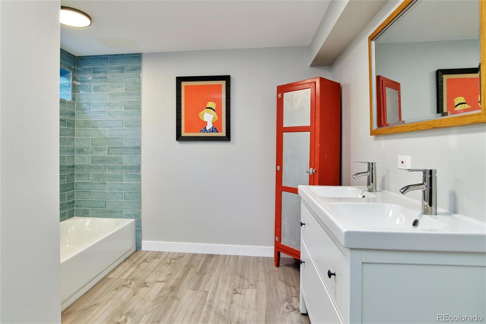3225 Vance Street Wheat Ridge, CO 80033 - Photo 19 of 29 a bathroom with a sink and a bathtub