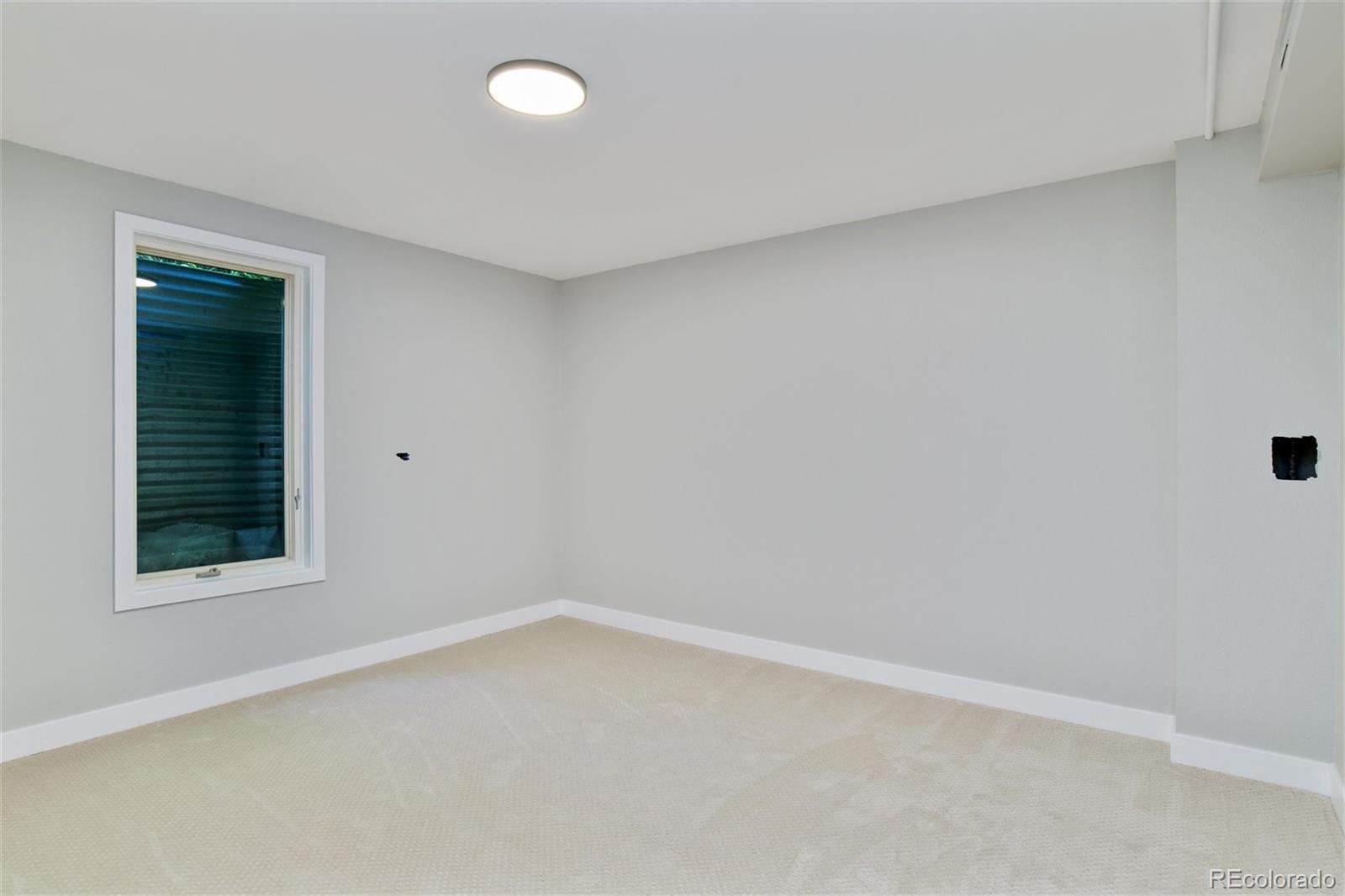 3225 Vance Street Wheat Ridge, CO 80033 - Photo 20 of 29 an empty room with a window