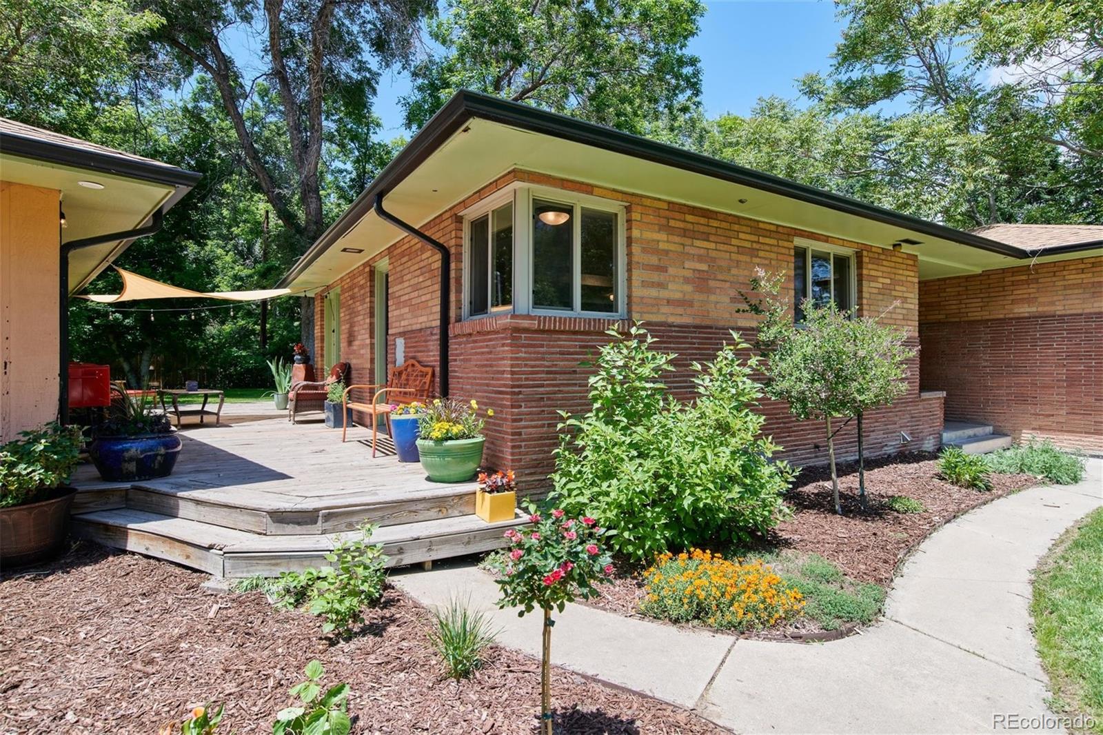 3225 Vance Street Wheat Ridge, CO 80033 - Photo 21 of 29 a front view of a house with garden