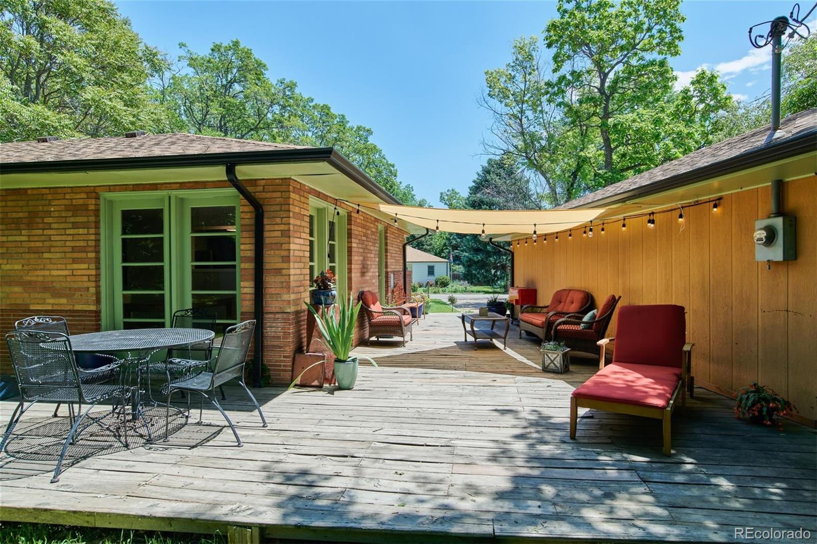 3225 Vance Street Wheat Ridge, CO 80033 - Photo 23 of 29 a backyard of a house with seating space
