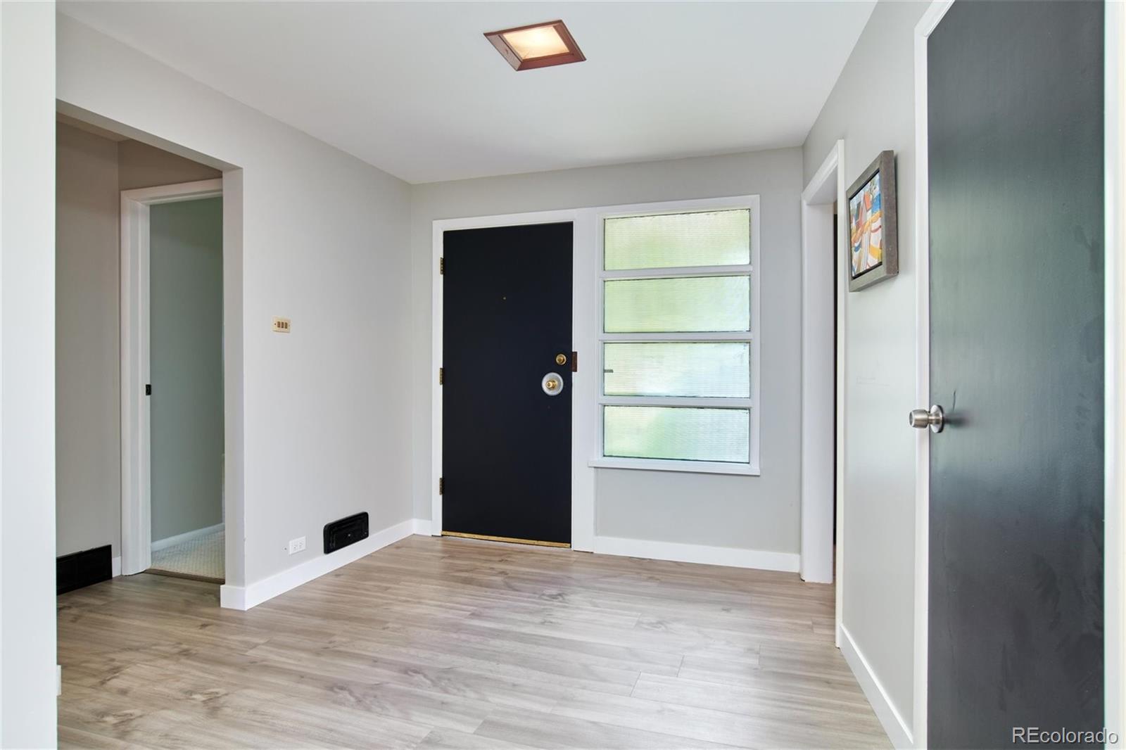3225 Vance Street Wheat Ridge, CO 80033 - Photo 3 of 29 a view of an empty room with closet and a window