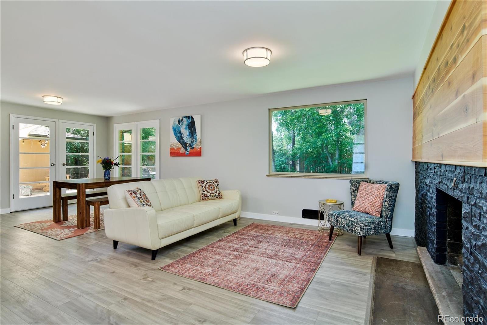 3225 Vance Street Wheat Ridge, CO 80033 - Photo 9 of 29 a living room with furniture and a fireplace