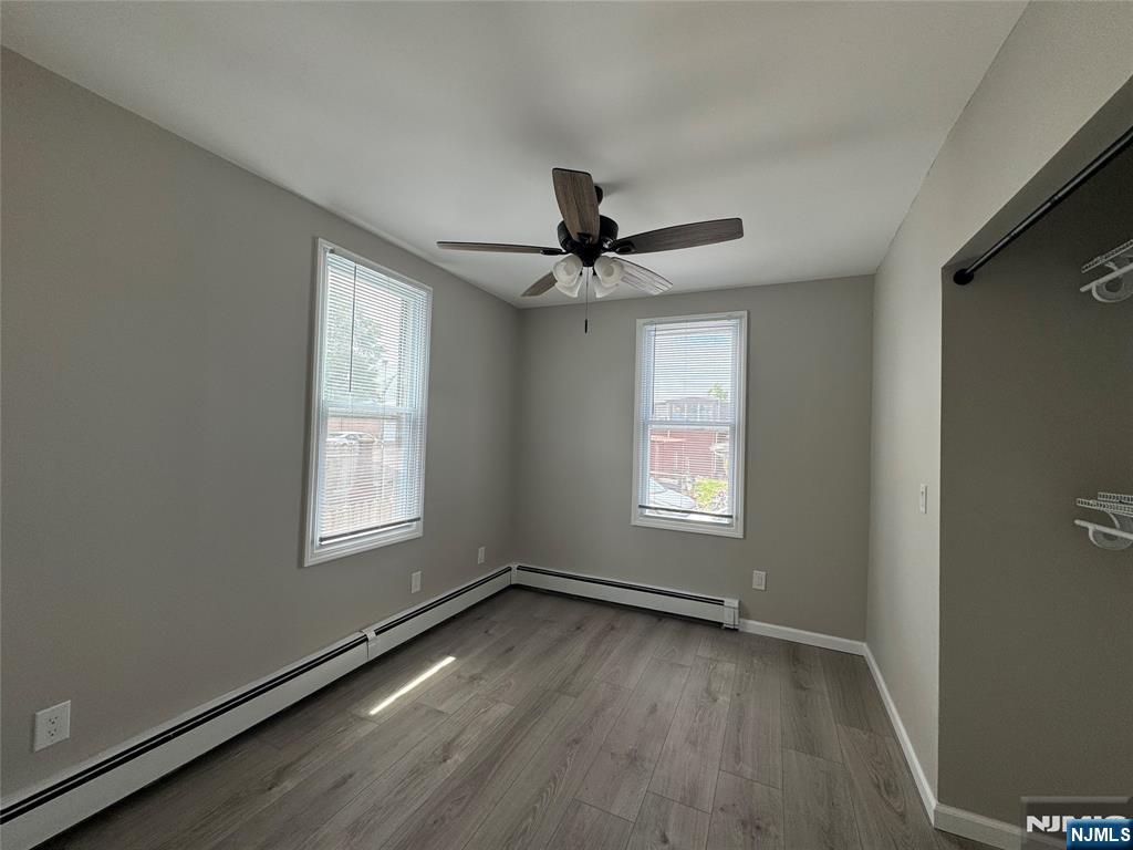138 Carlton Avenue East Rutherford, NJ 07073 - Photo 12 of 14 a view of an empty room with a window