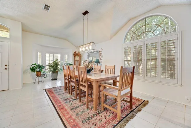 a view of a dining room with furniture