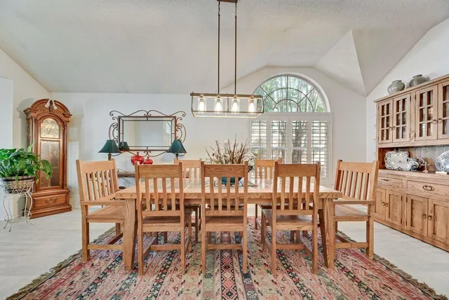 a bed room with a bed and a chandelier