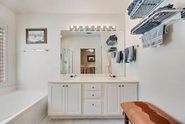 a bathroom with a bathtub and a shower