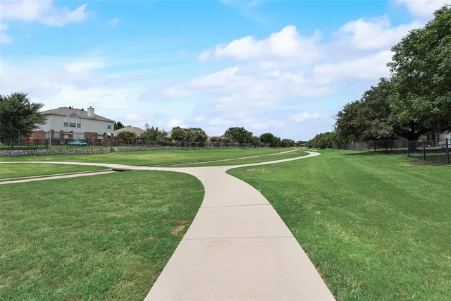 a view of a house with a back yard