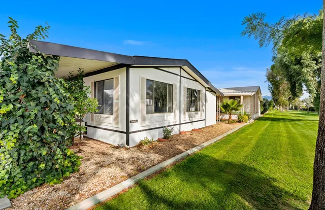 a view of house with backyard porch and outdoor seating