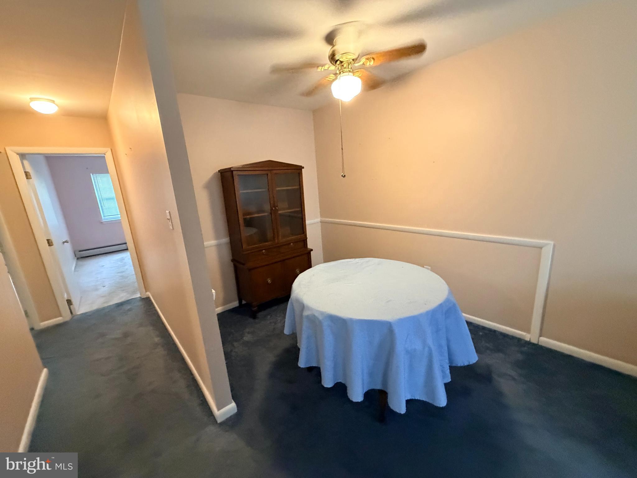 4701 Pennell Road, Unit H3 Aston, PA 19014 - Photo 7 of 18 a bathroom with a sink a toilet a light fixture and a mirror