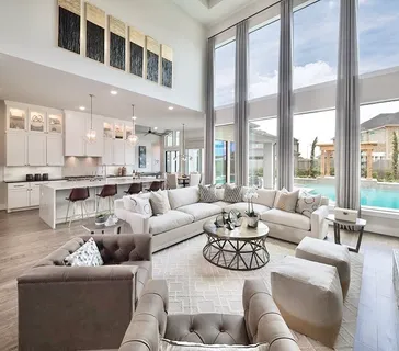 a living room with furniture or couch and a large window