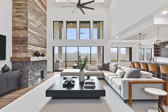 a kitchen with stainless steel appliances granite countertop a sink a stove and a wooden floors