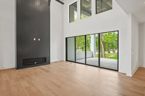 a kitchen with a sink a counter and chairs