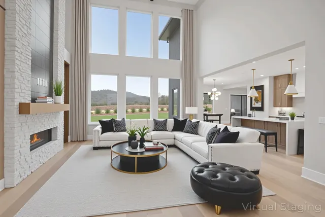 a spacious bedroom with a bed a couch and a painting on the wall