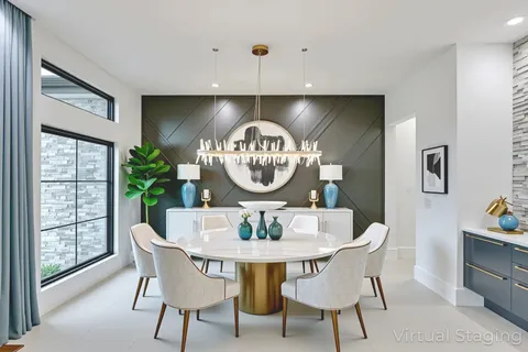 a dining room with furniture a chandelier and wooden floor