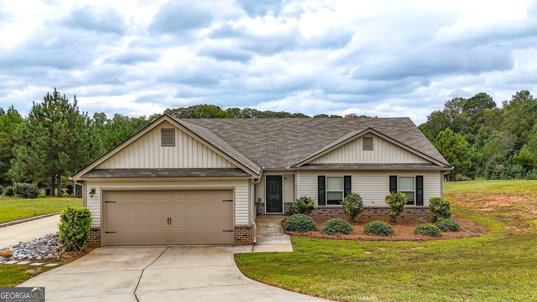 a view of a house with swimming pool and sitting area