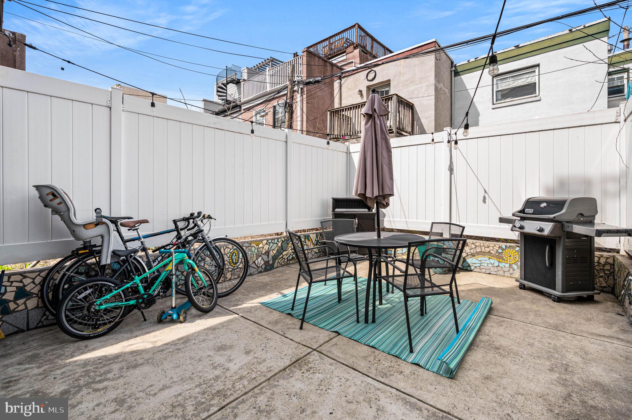 1825 Carpenter Street, Unit A Philadelphia, PA 19146 - Photo 12 of 25 a view of a patio with table and chairs with plants