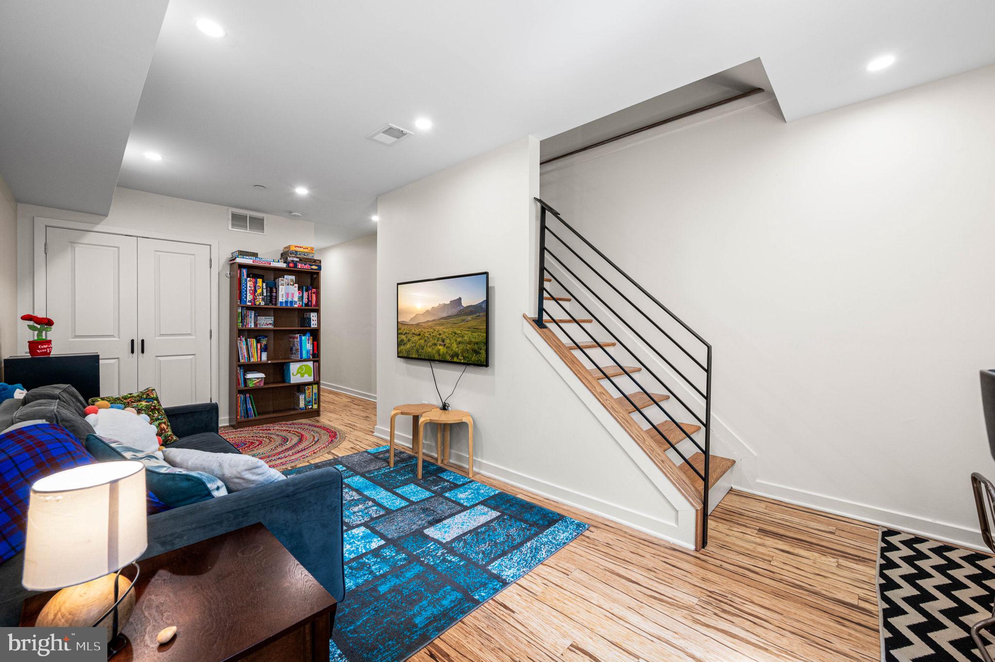 1825 Carpenter Street, Unit A Philadelphia, PA 19146 - Photo 14 of 25 a workspace with furniture bookshelf and a window