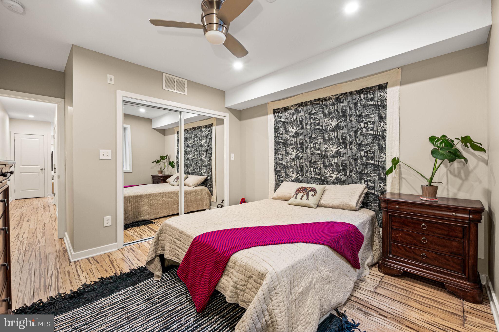 1825 Carpenter Street, Unit A Philadelphia, PA 19146 - Photo 19 of 25 a living room with a bed and furniture