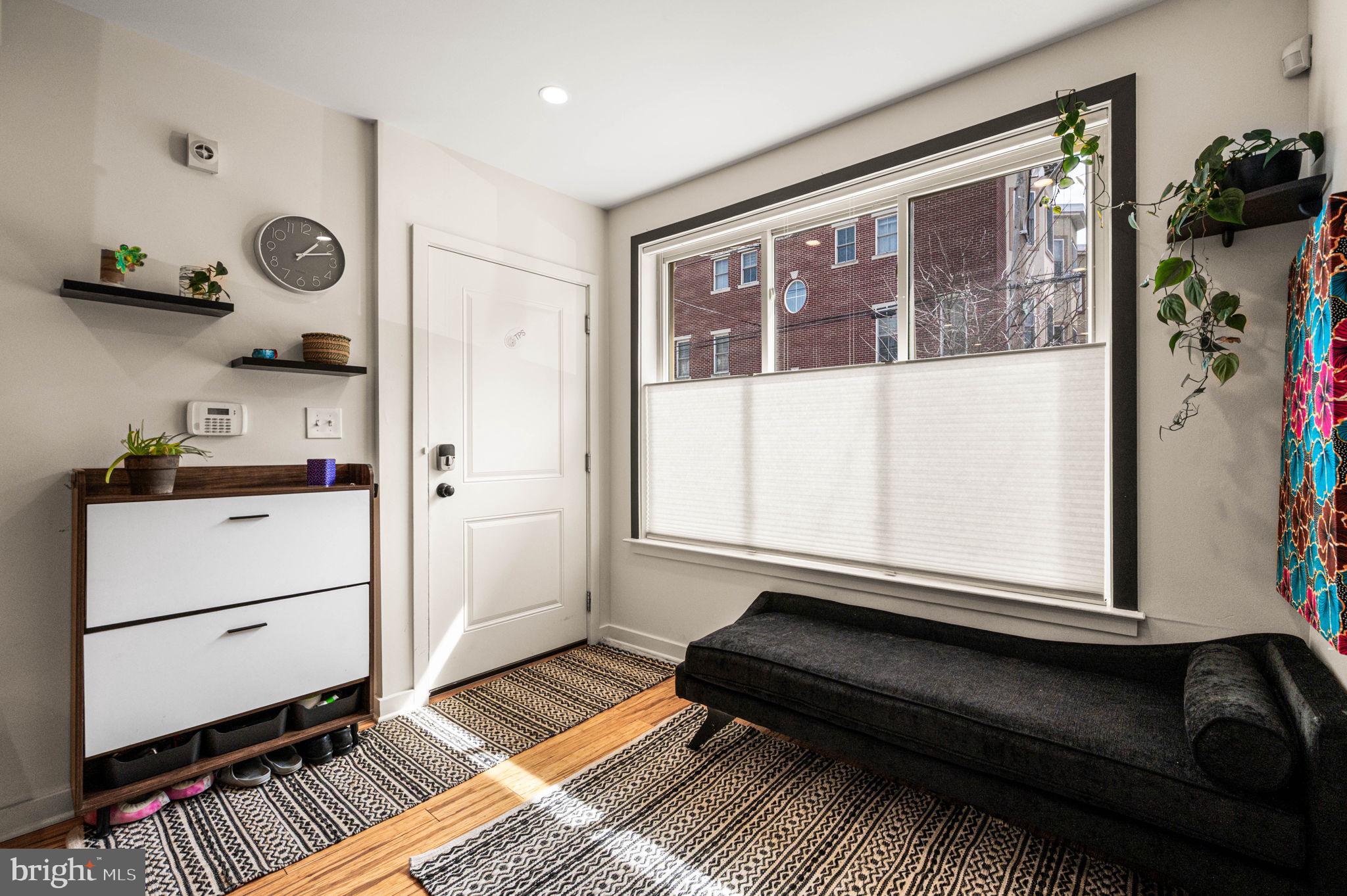 1825 Carpenter Street, Unit A Philadelphia, PA 19146 - Photo 2 of 25 a living room with furniture and wooden floor