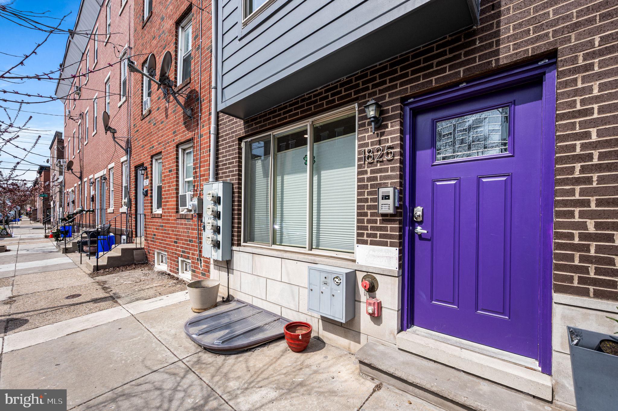 1825 Carpenter Street, Unit A Philadelphia, PA 19146 - Photo 23 of 25 a front view of a building with red door