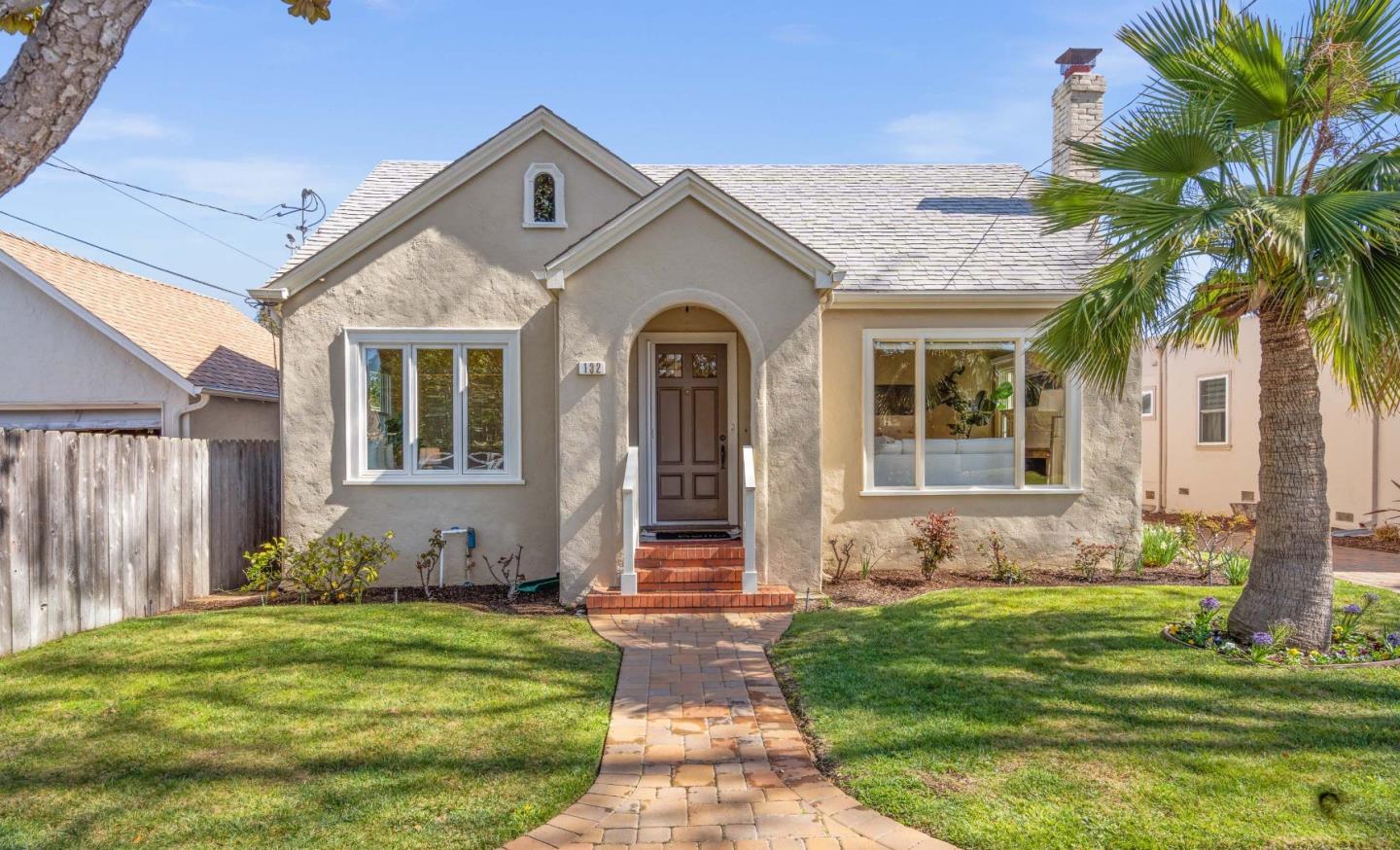 132 Bancroft Road Burlingame, CA 94010 - Photo 1 of 39 a front view of a house with garden
