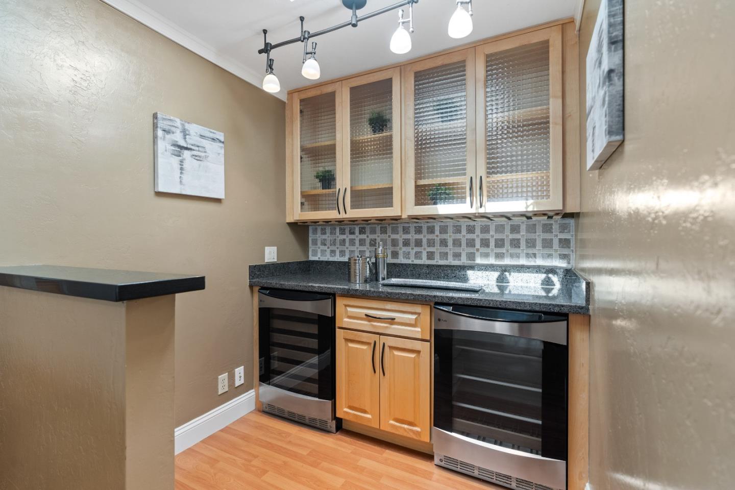 132 Bancroft Road Burlingame, CA 94010 - Photo 11 of 39 a kitchen with stainless steel appliances granite countertop a stove and a sink