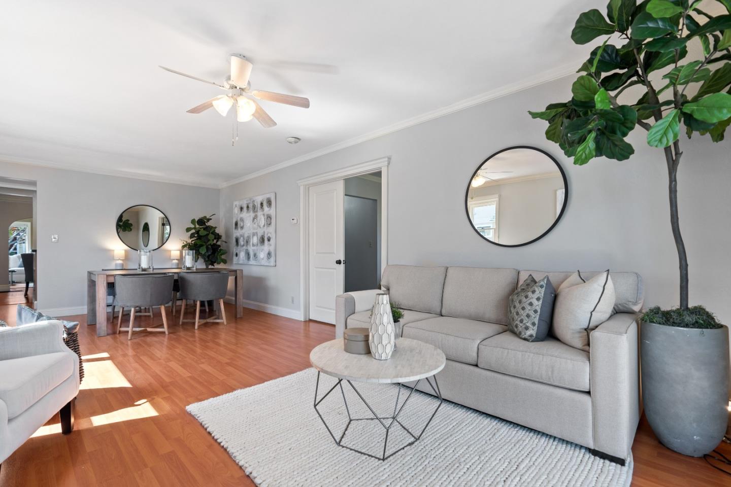 132 Bancroft Road Burlingame, CA 94010 - Photo 14 of 39 a living room with furniture potted plant and white walls