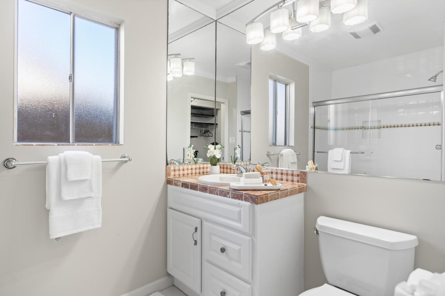 132 Bancroft Road Burlingame, CA 94010 - Photo 20 of 39 a bathroom with a toilet sink and mirror
