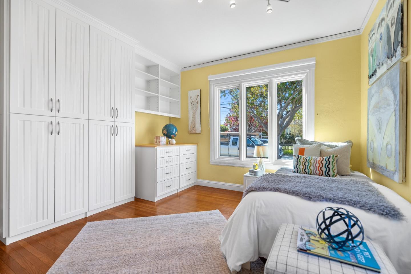 132 Bancroft Road Burlingame, CA 94010 - Photo 23 of 39 a bedroom with a bed and wooden floor