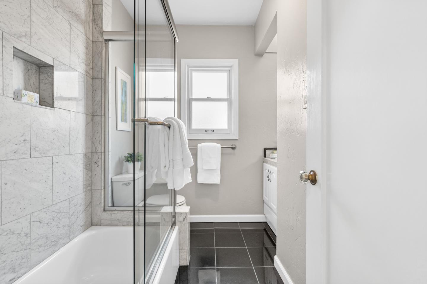 132 Bancroft Road Burlingame, CA 94010 - Photo 24 of 39 a bathroom with a tub and shower