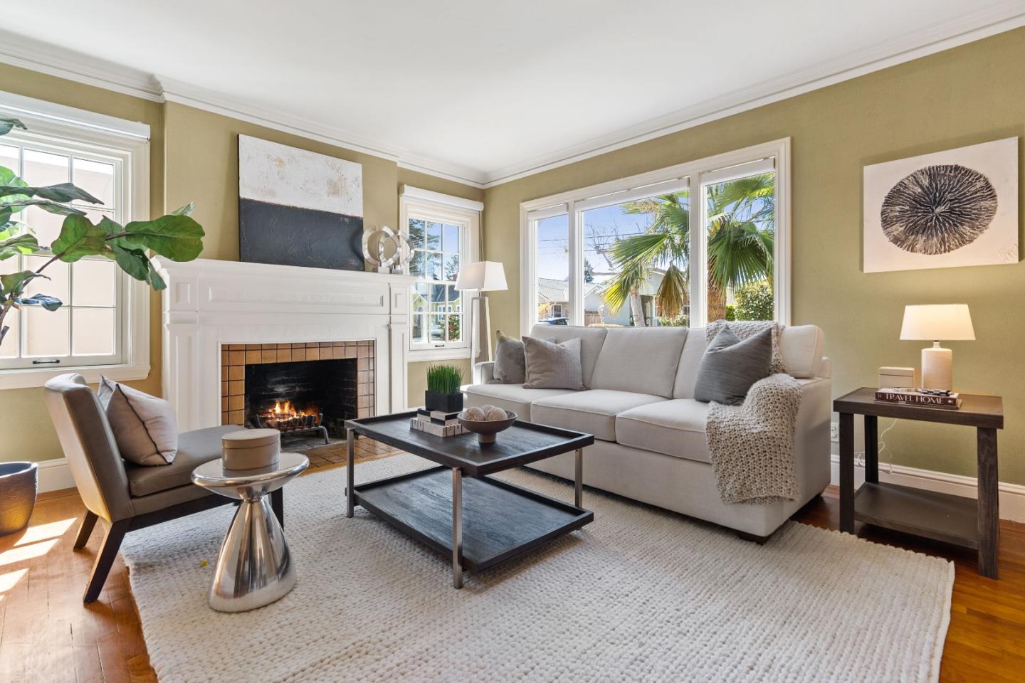 132 Bancroft Road Burlingame, CA 94010 - Photo 3 of 39 a living room with furniture a large window and a fireplace