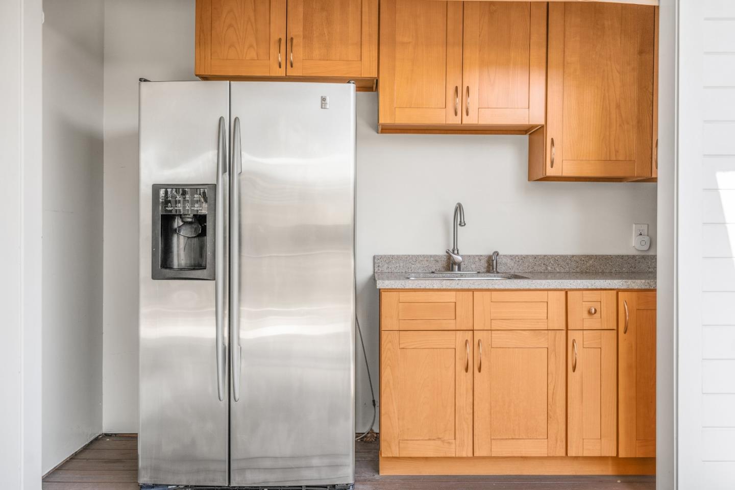 132 Bancroft Road Burlingame, CA 94010 - Photo 33 of 39 a kitchen with stainless steel appliances granite countertop a refrigerator and cabinets