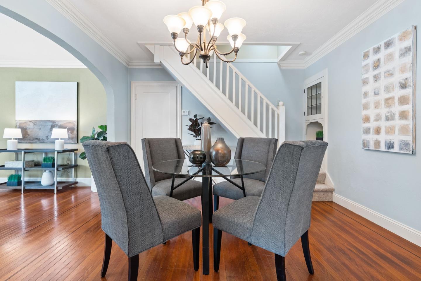 132 Bancroft Road Burlingame, CA 94010 - Photo 6 of 39 a view of a dining room with furniture a chandelier and wooden floor