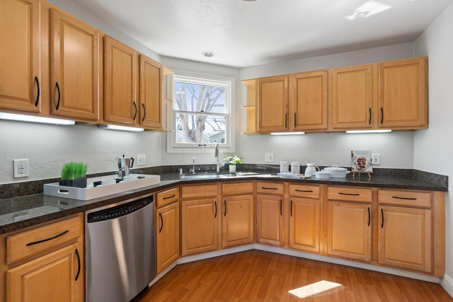 132 Bancroft Road Burlingame, CA 94010 - Photo 10 of 39 a kitchen with stainless steel appliances granite countertop a sink a stove and cabinets