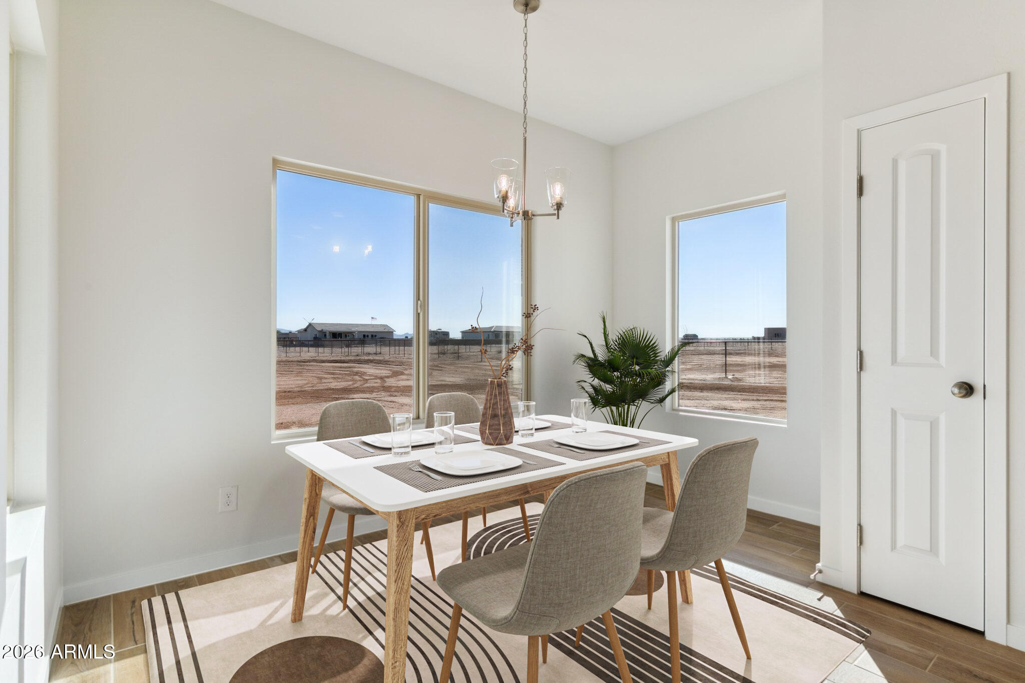5758 North Jessie Road Casa Grande, AZ 85194 - Photo 4 of 12 a view of a dining room with furniture window and wooden floor