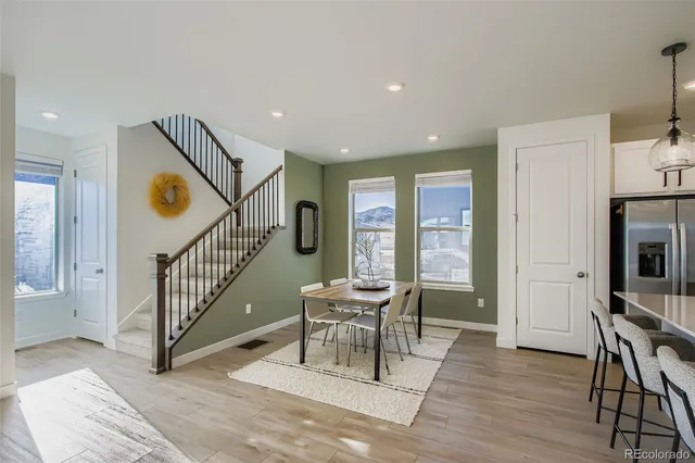 a view of a hallway with furniture and windows
