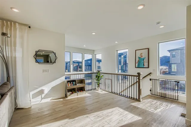 a view of livingroom with furniture flat screen tv and staircase