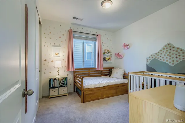 a bedroom with a bed and a table in it