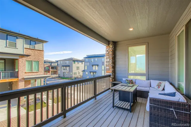 a view of a balcony with chairs