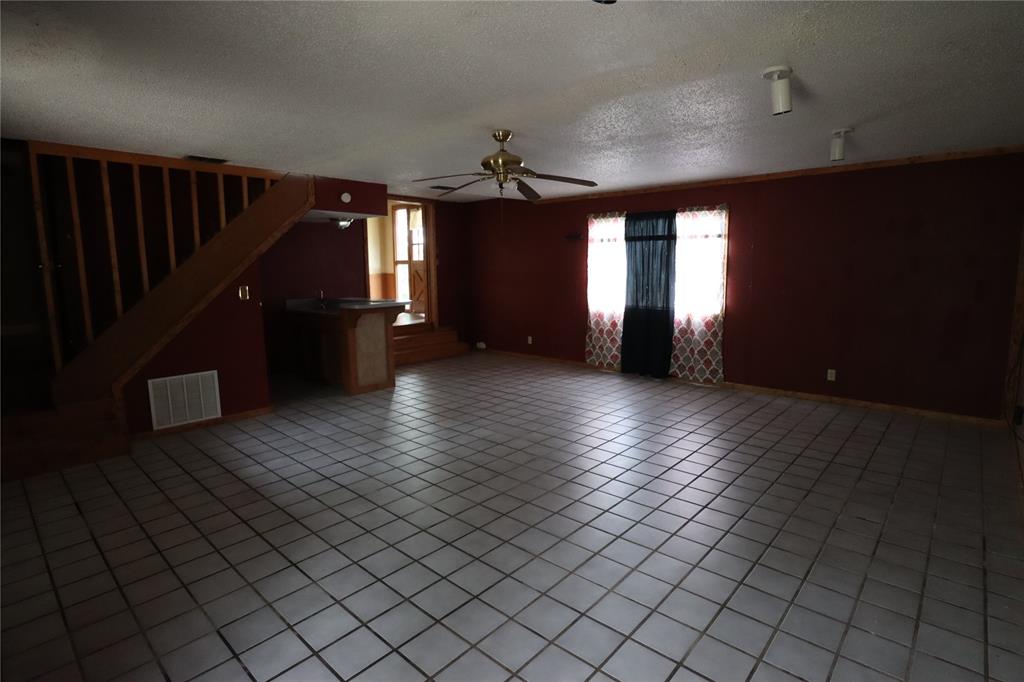 431 Walnut Street Ranger, TX 76470 - Photo 19 of 37 an empty room with windows