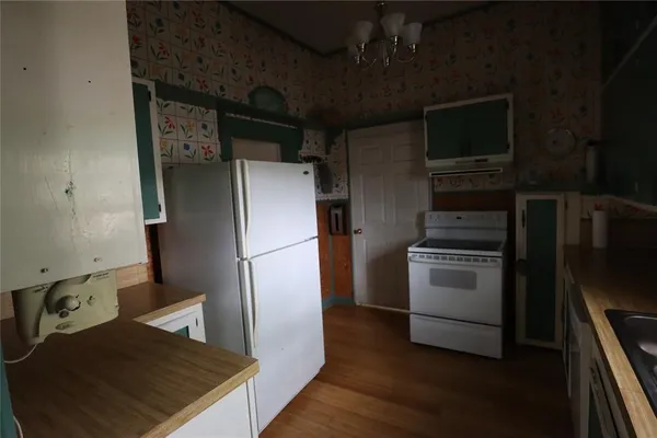 a view of a bedroom from a hallway