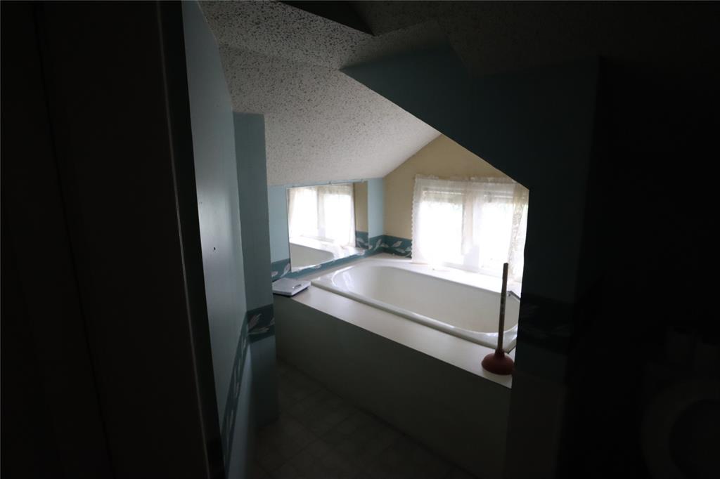 431 Walnut Street Ranger, TX 76470 - Photo 37 of 37 a bathroom with a sink and a mirror
