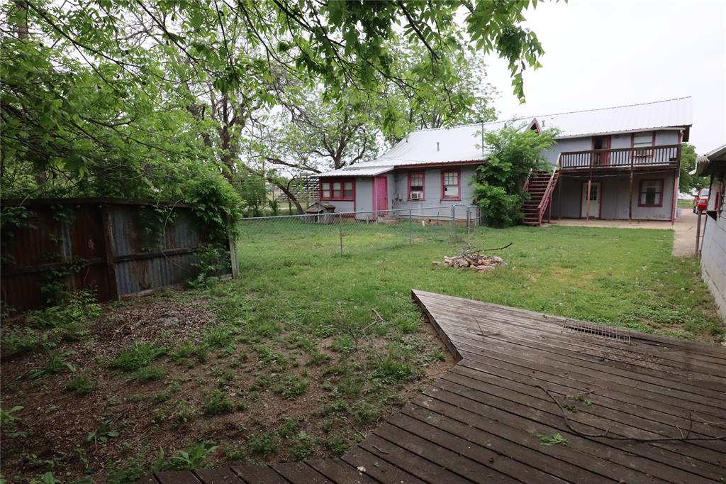 431 Walnut Street Ranger, TX 76470 - Photo 6 of 37 a view of a house with a yard