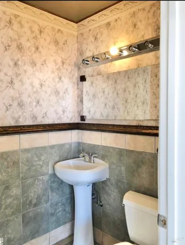 a bathroom with a sink and mirror